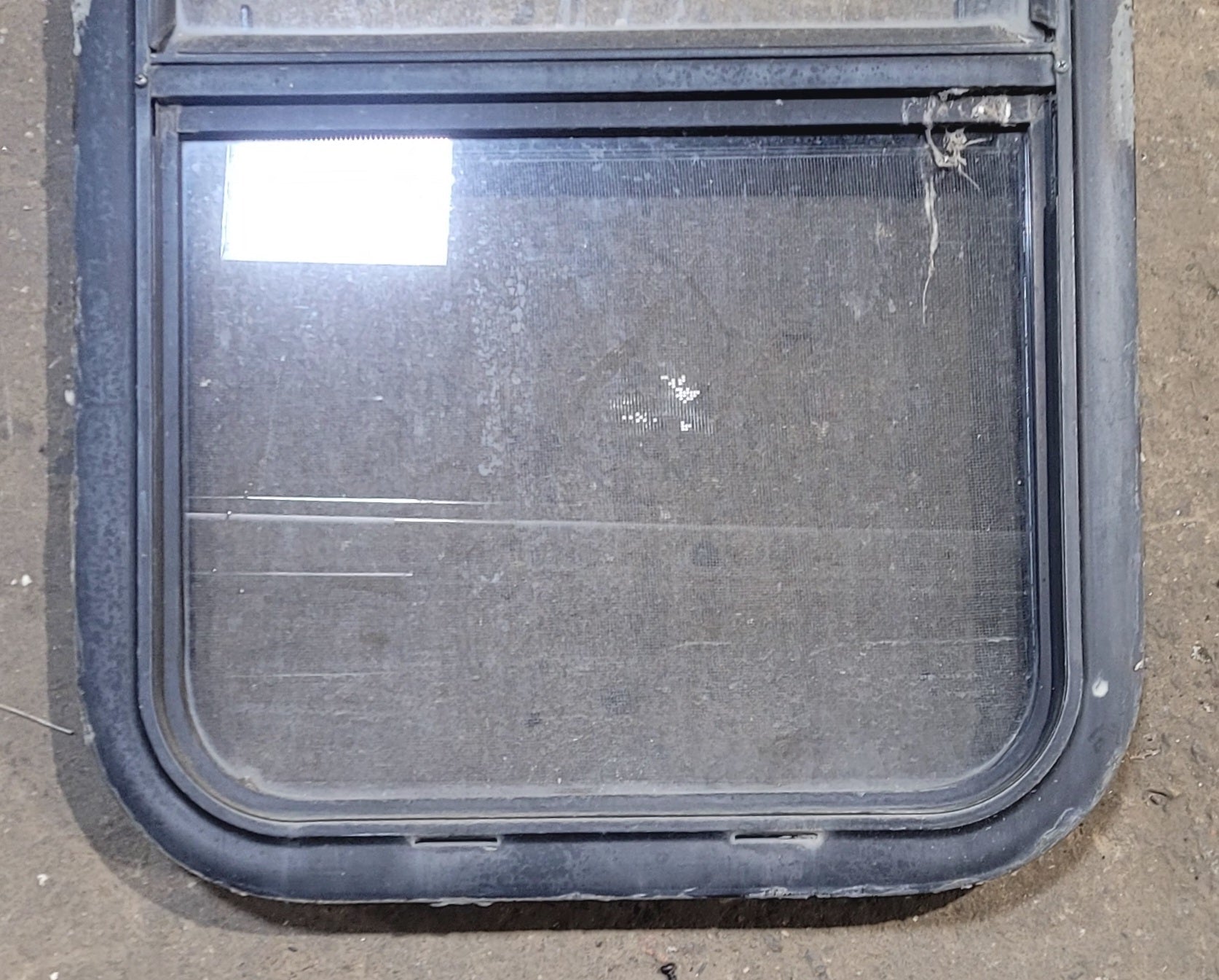 Used Black Radius Opening Window : 17 1/2" W x 28 1/2" H x 1 7/8" - Young Farts RV Parts