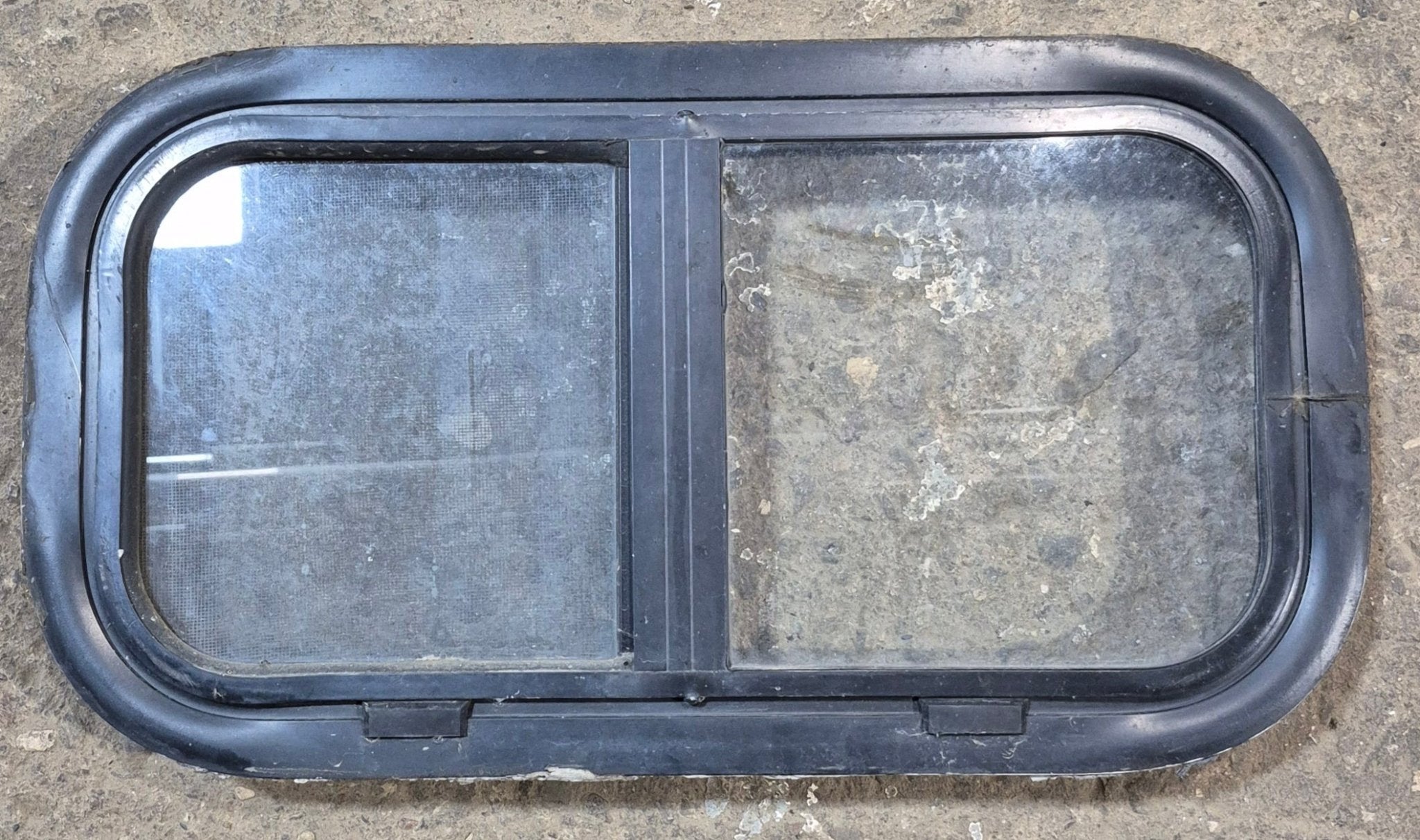 Used Black Radius Opening Window : 20 3/4" W x 10 3/4" H x 1 7/8" - Young Farts RV Parts