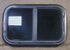 Used Black Radius Opening Window : 23 1/2" W x 14 1/2" H x 1 7/8" D - Young Farts RV Parts