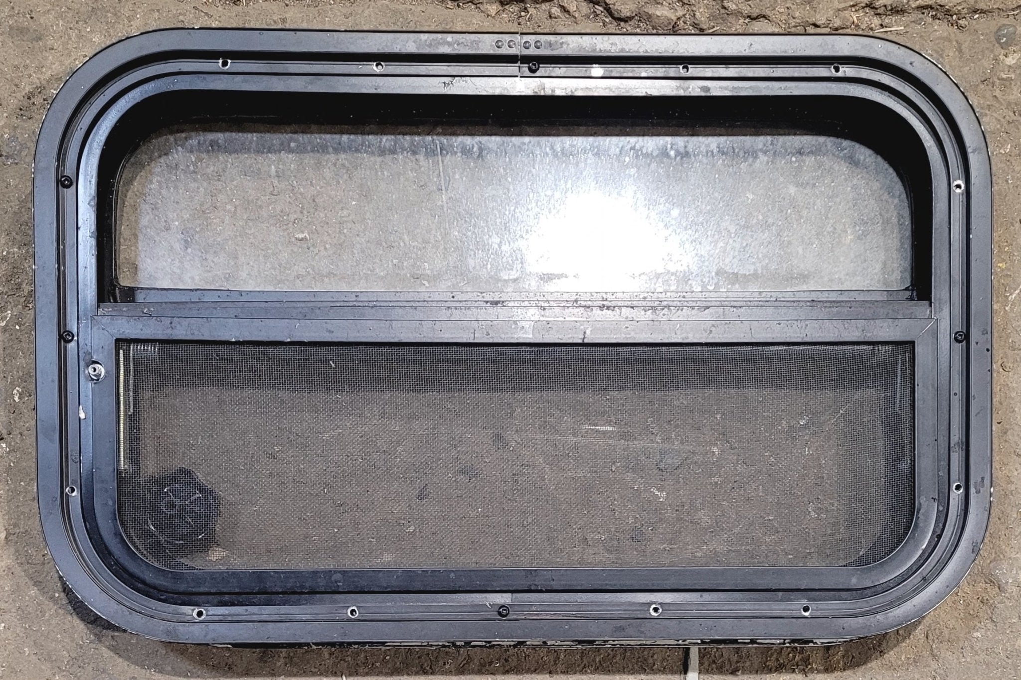 Used Black Radius Opening Window : 23 1/2" W x 14 1/4" H x 1 7/8" - Young Farts RV Parts