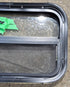 Used Black Radius Opening Window : 23 1/2" W x 14 1/4" H x 1 7/8" - Young Farts RV Parts