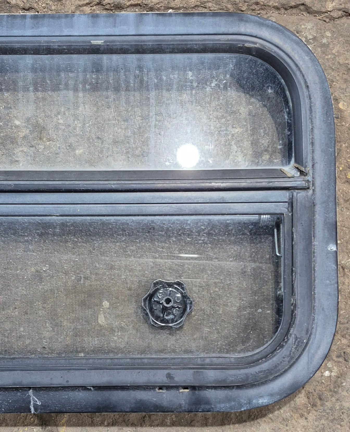 Used Black Radius Opening Window : 23 1/2" W x 14 1/4" H x 1 7/8" - Young Farts RV Parts