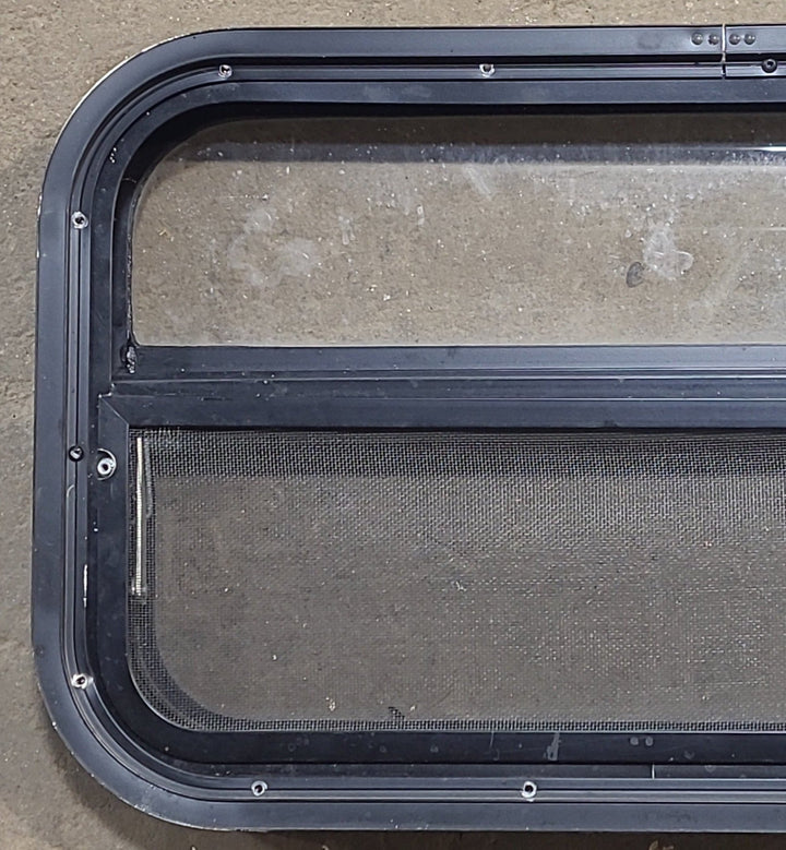 Used Black Radius Opening Window : 23 1/2" W x 14 1/4" H x 1 7/8" D - Young Farts RV Parts
