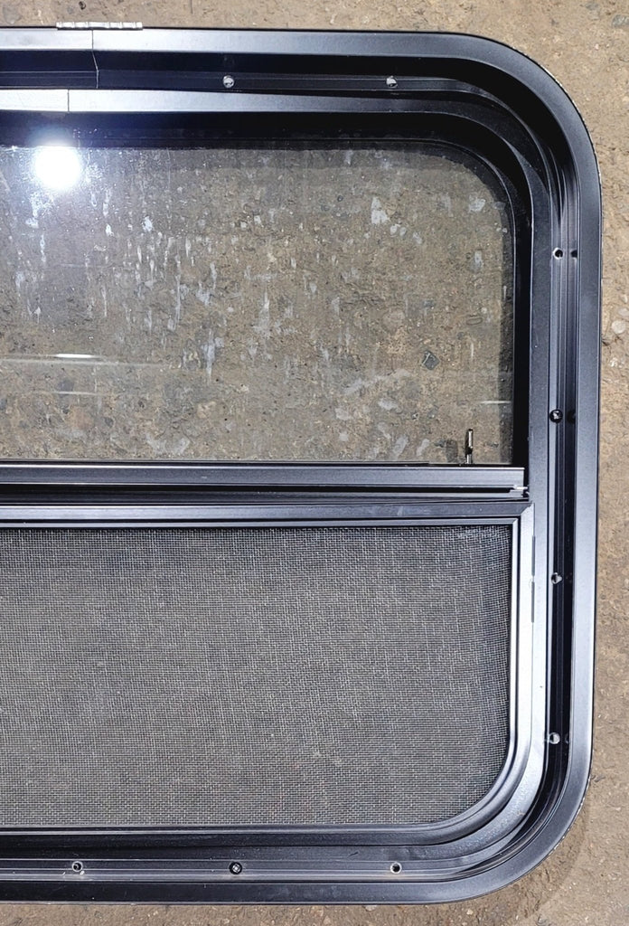 Used Black Radius Opening Window : 23 1/2" W x 19 1/4" H x 1 7/8" - Young Farts RV Parts