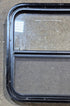 Used Black Radius Opening Window : 23 1/2" W x 21 1/2" H x 1 3/8" - Young Farts RV Parts