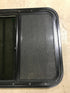 Used Black Radius Opening Window : 23 1/2" W x 21 1/2" H x 1 7/8" D - Young Farts RV Parts