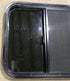 Used Black Radius Opening Window : 23 1/2" W x 21 1/2" H x 1 7/8" D - Young Farts RV Parts