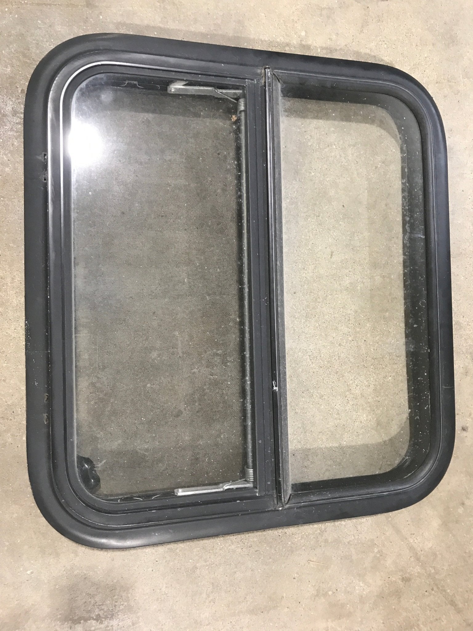 Used Black Radius Opening Window : 23 1/2" W X 21 1/4" H X 2" D - Young Farts RV Parts