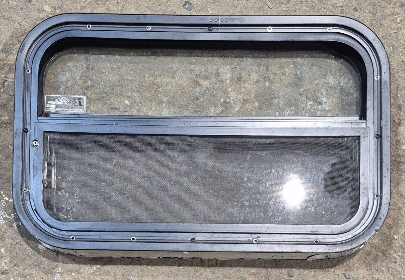 Used Black Radius Opening Window : 23 1/4" W x 14 1/4" H x 1 7/8" - Young Farts RV Parts