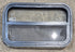 Used Black Radius Opening Window : 23 1/4" W x 14 1/4" H x 1 7/8" - Young Farts RV Parts