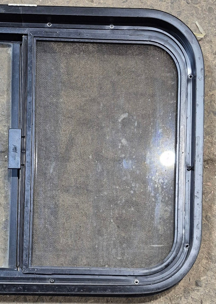 Used Black Radius Opening Window : 23 1/4" W x 17 1/4" H x 1 3/4" - Young Farts RV Parts