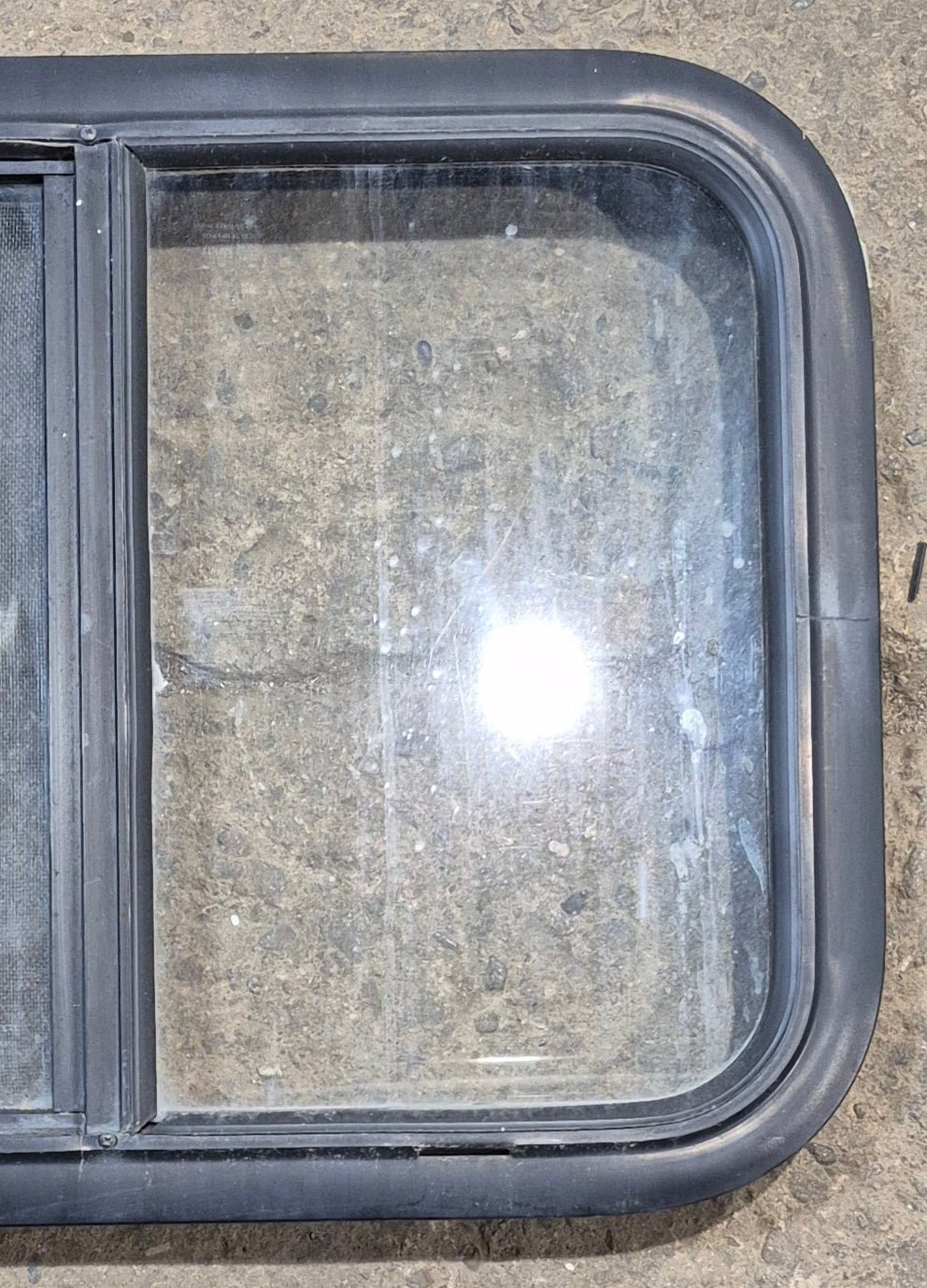 Used Black Radius Opening Window : 23 1/4" W x 17 1/4" H x 1 3/4" - Young Farts RV Parts