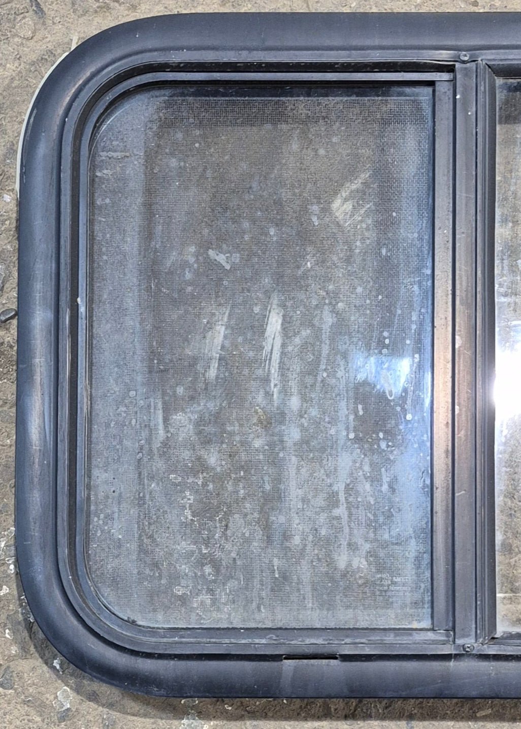 Used Black Radius Opening Window : 23 1/4" W x 17 1/4" H x 1 3/4" - Young Farts RV Parts