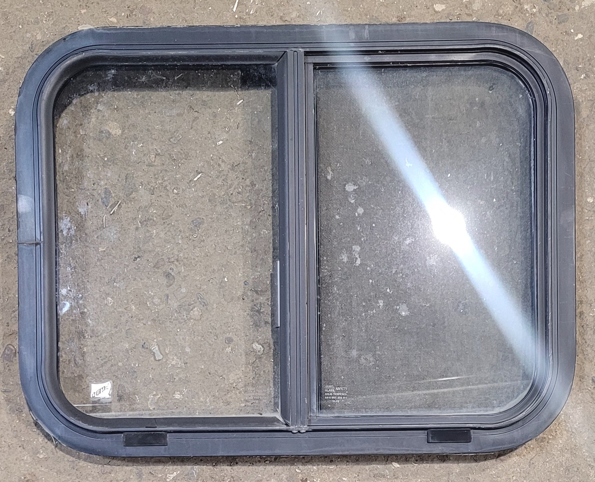 Used Black Radius Opening Window : 23 1/4" W x 17 3/4" H x 1 3/4" - Young Farts RV Parts