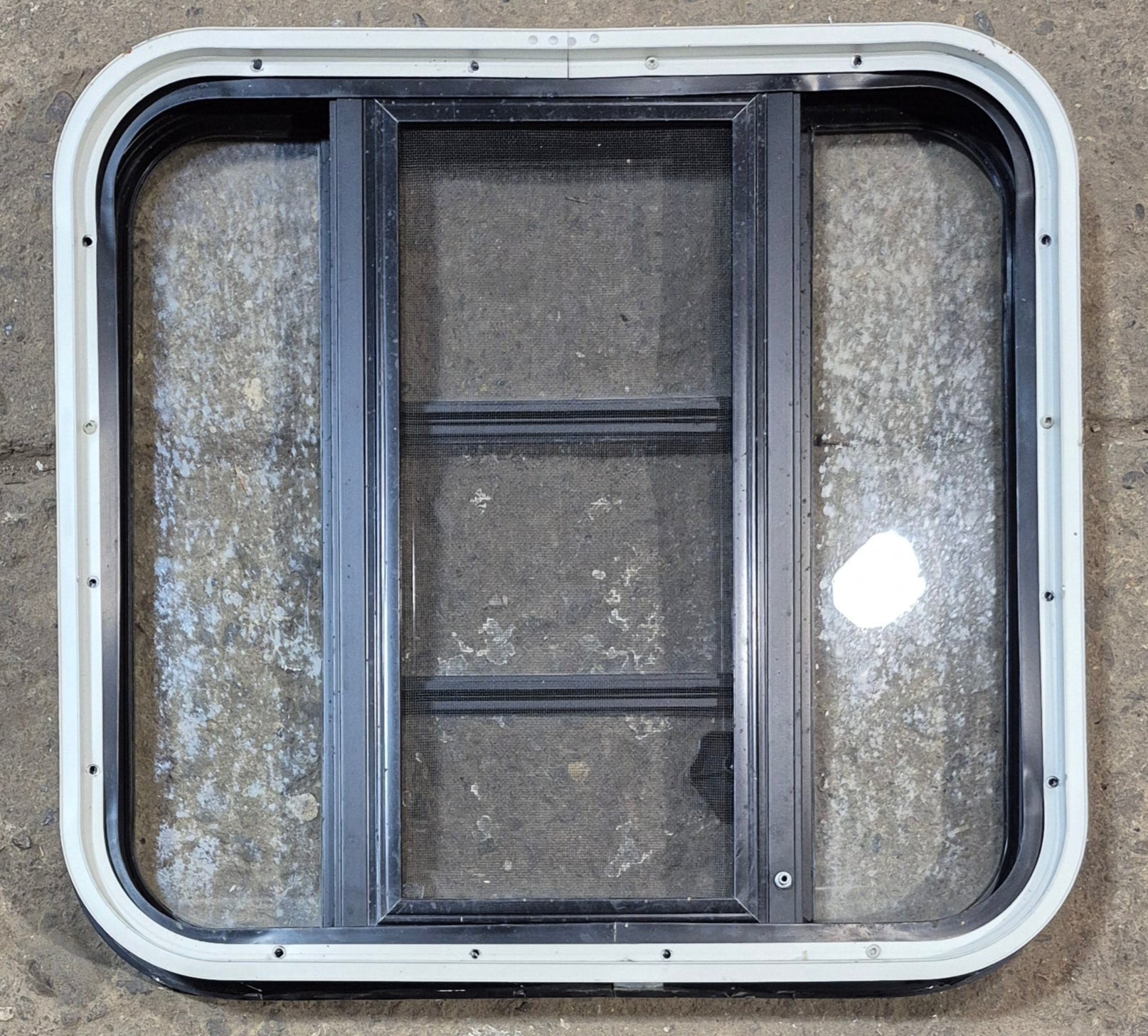 Used Black Radius Opening Window : 23 1/4" W x 21 3/4" H x 1 7/8" - Young Farts RV Parts