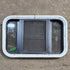 Used Black Radius Opening Window - 23 1/8" X 14 1/2" X 1 7/8" - Young Farts RV Parts