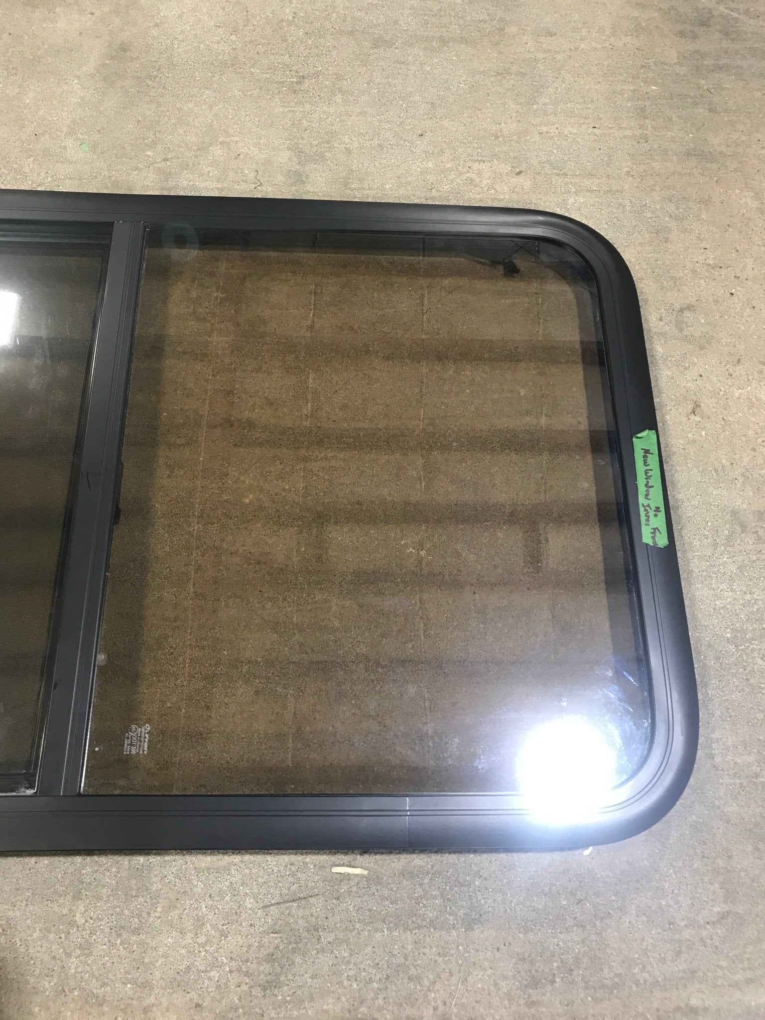 Used Black Radius Opening Window : 23 3/4" W x 39 3/4" H x 1 1/2" D - Young Farts RV Parts