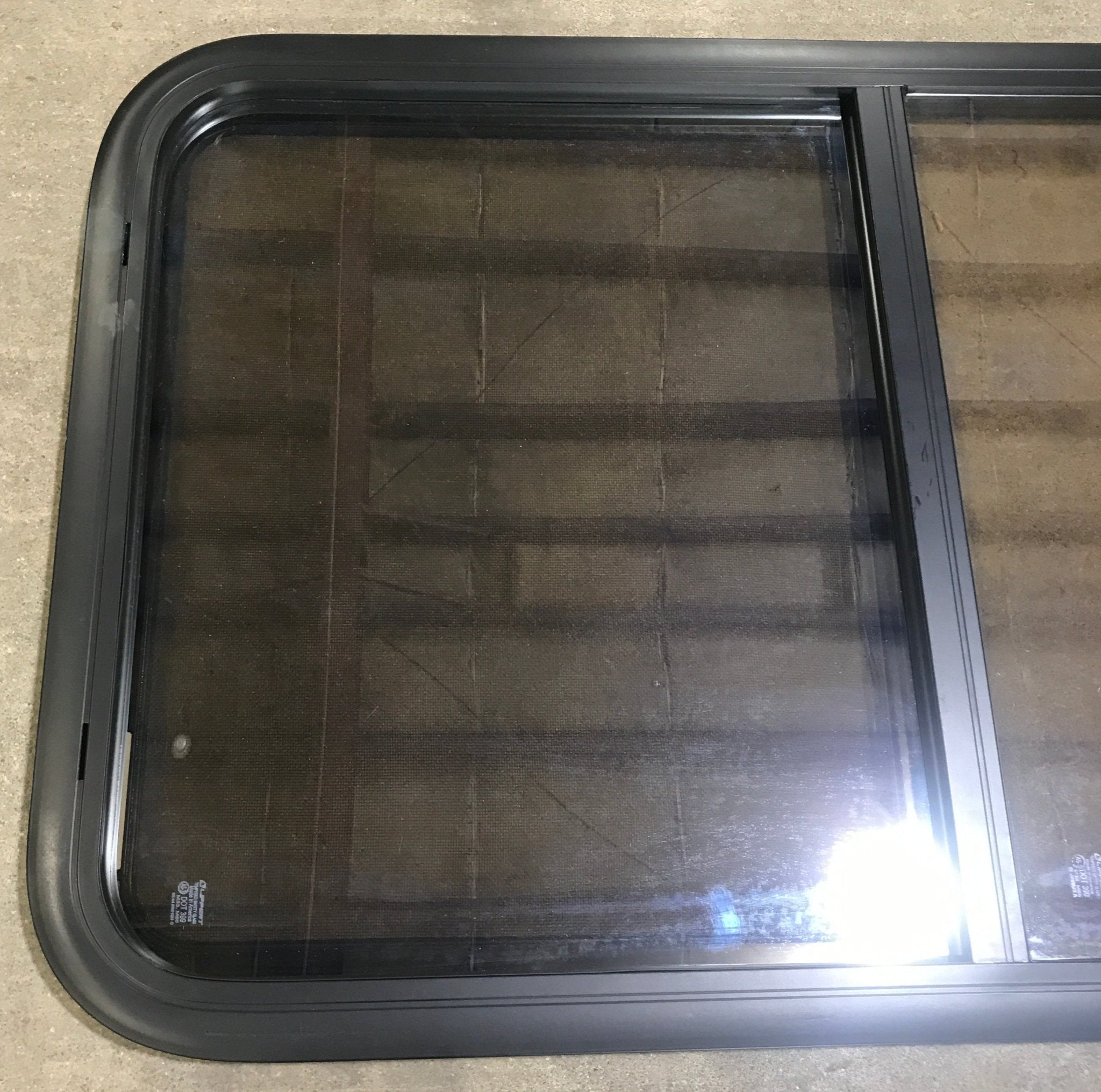Used Black Radius Opening Window : 23 3/4" W x 39 3/4" H x 1 1/2" D - Young Farts RV Parts