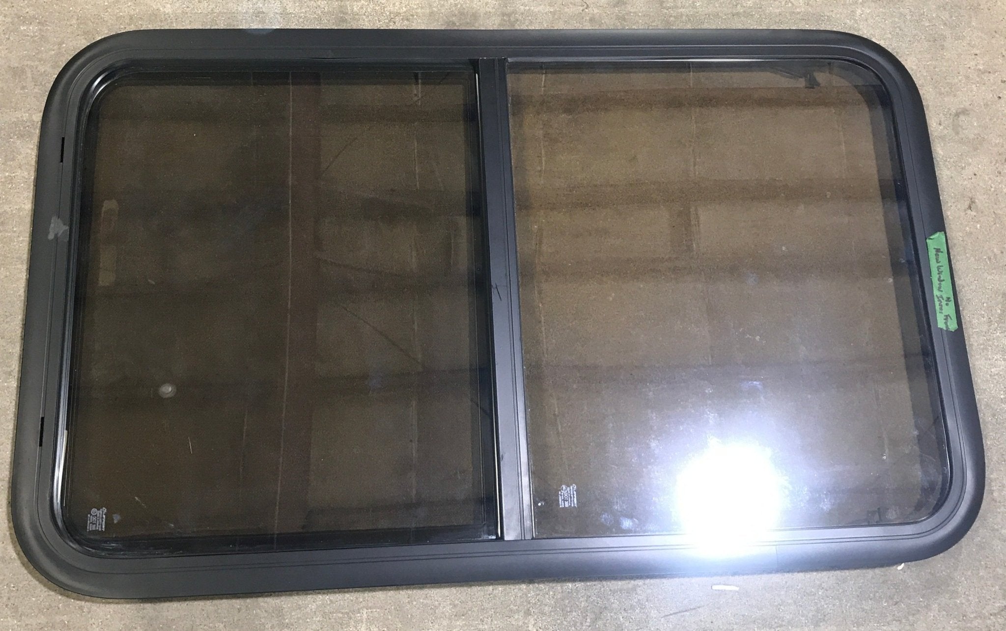 Used Black Radius Opening Window : 23 3/4" W x 39 3/4" H x 1 1/2" D - Young Farts RV Parts