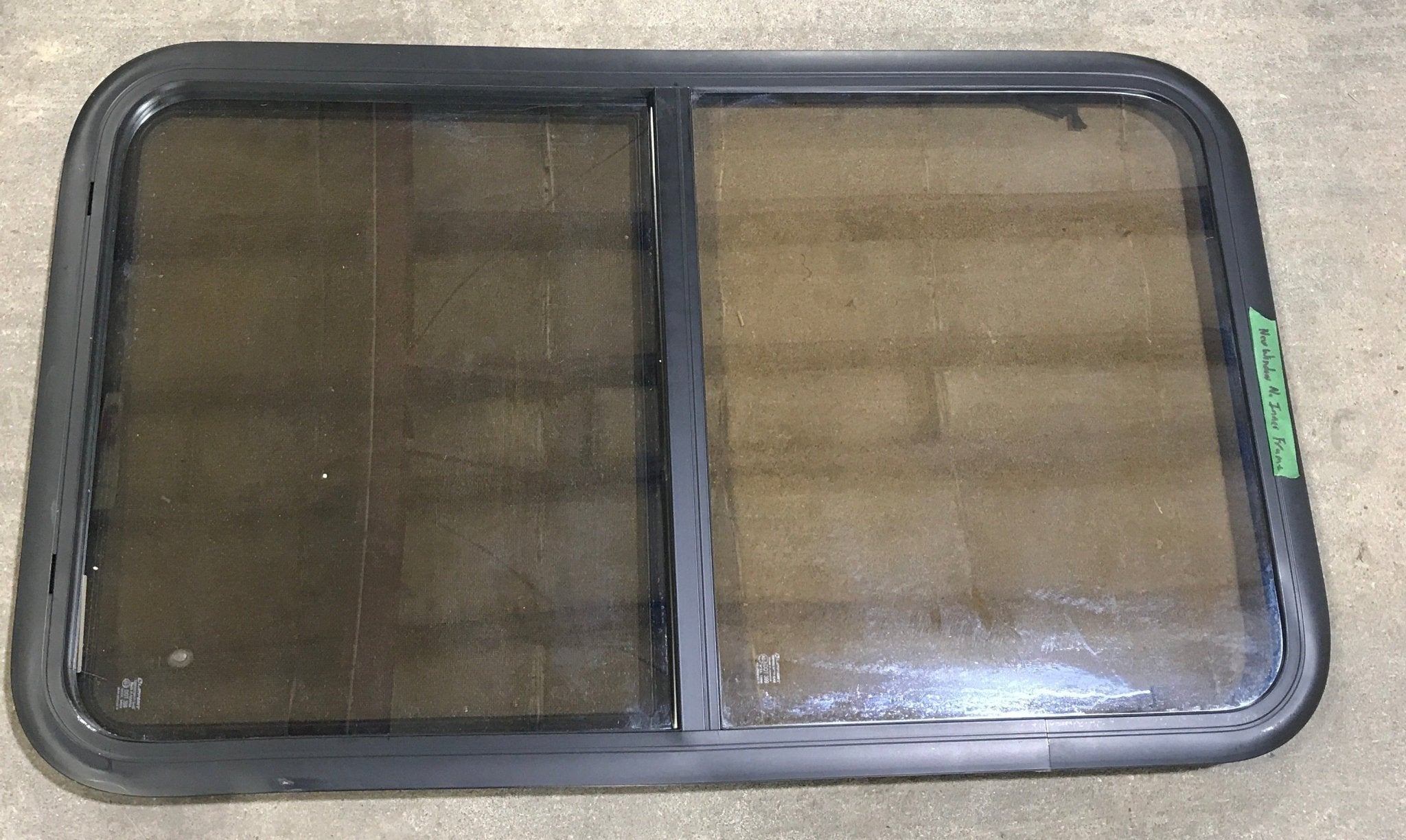 Used Black Radius Opening Window : 23 3/4" W x 39 3/4" H x 1 1/2" D - Young Farts RV Parts