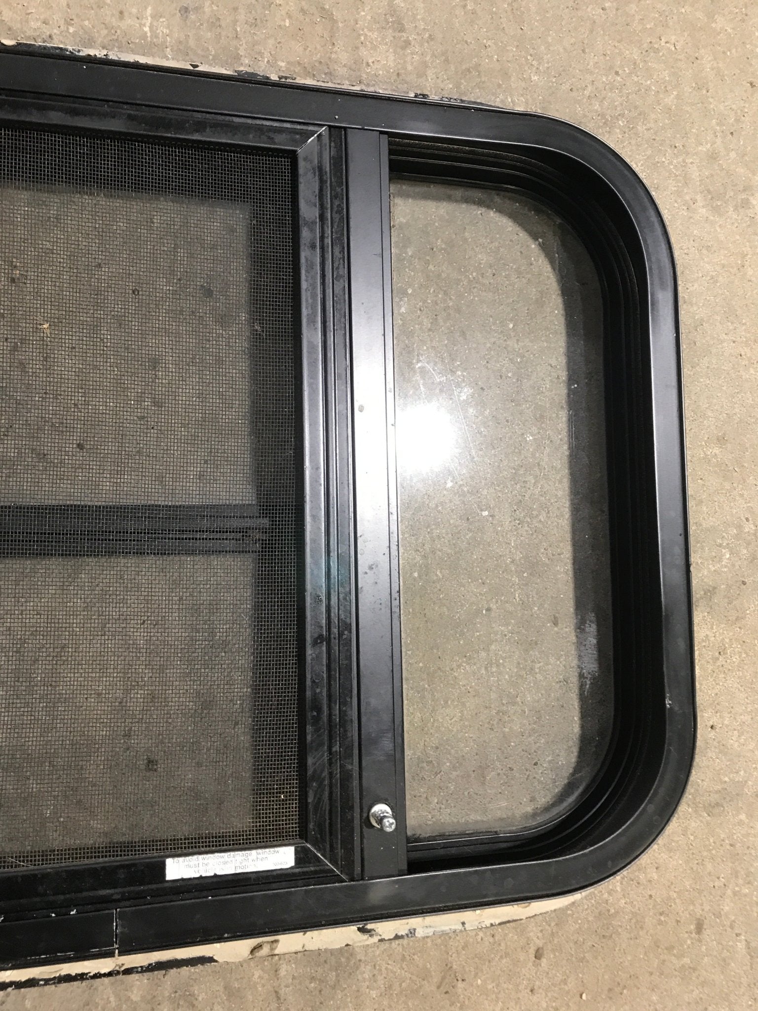 Used Black Radius Opening Window : 24 1/2" W x 16" H x 1 1/2" - Young Farts RV Parts