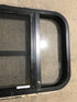 Used Black Radius Opening Window : 24 1/2" W x 16" H x 1 1/2" - Young Farts RV Parts