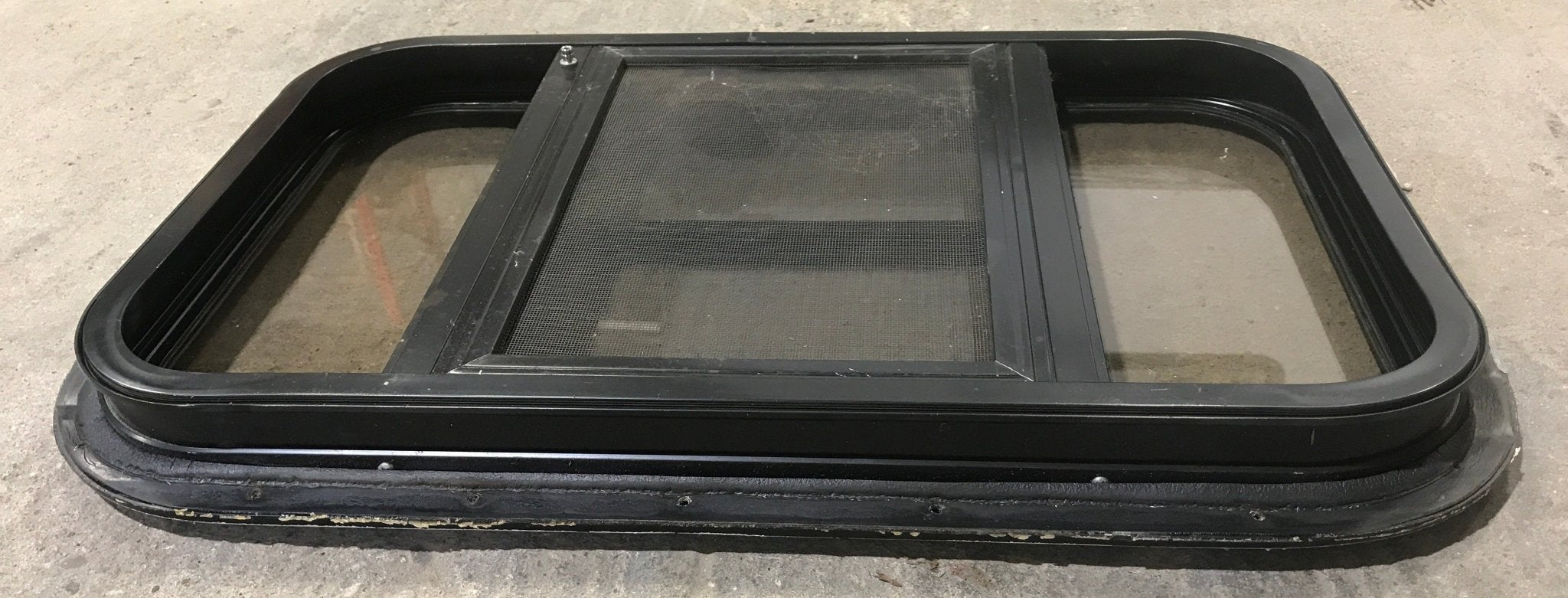 Used Black Radius Opening Window : 24 1/2" W x 16" H x 1 1/2" - Young Farts RV Parts