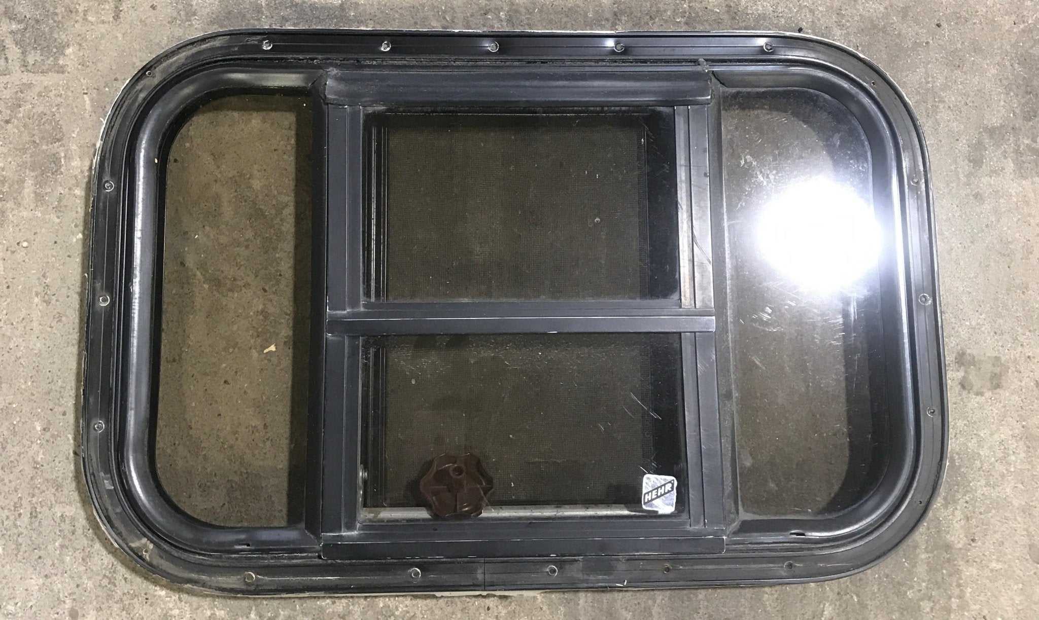 Used Black Radius Opening Window : 24 1/2" W x 16" H x 1 1/2" - Young Farts RV Parts