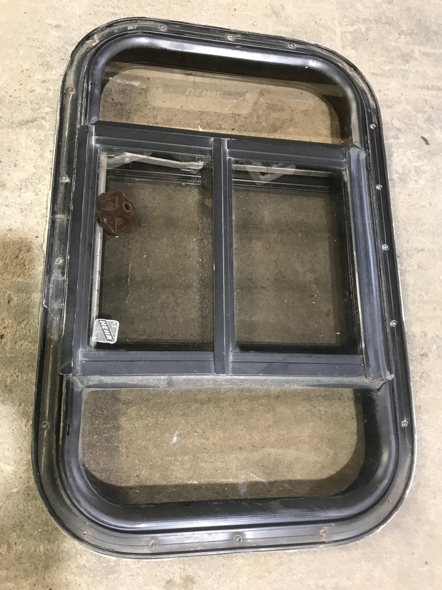 Used Black Radius Opening Window : 24 1/2" W x 16" H x 1 1/2" - Young Farts RV Parts