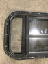 Used Black Radius Opening Window : 24 1/2" W x 16" H x 1 1/2" - Young Farts RV Parts