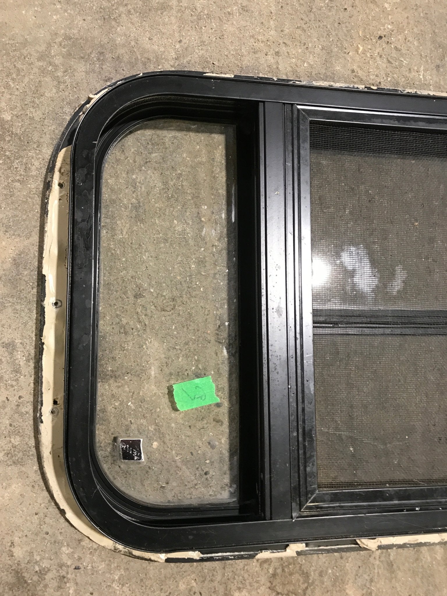 Used Black Radius Opening Window : 24 1/2" W x 16" H x 1 1/2" - Young Farts RV Parts