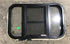 Used Black Radius Opening Window : 24 1/2" W x 16" H x 1 1/2" - Young Farts RV Parts