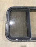 Used Black Radius Opening Window : 24 1/2" W x 19 1/4" H x 1 1/4" - Young Farts RV Parts