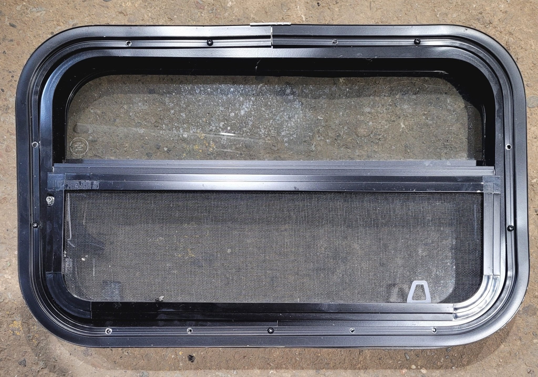 Used Black Radius Opening Window : 24 1/4" W x 14 1/4" H x 1 7/8" - Young Farts RV Parts