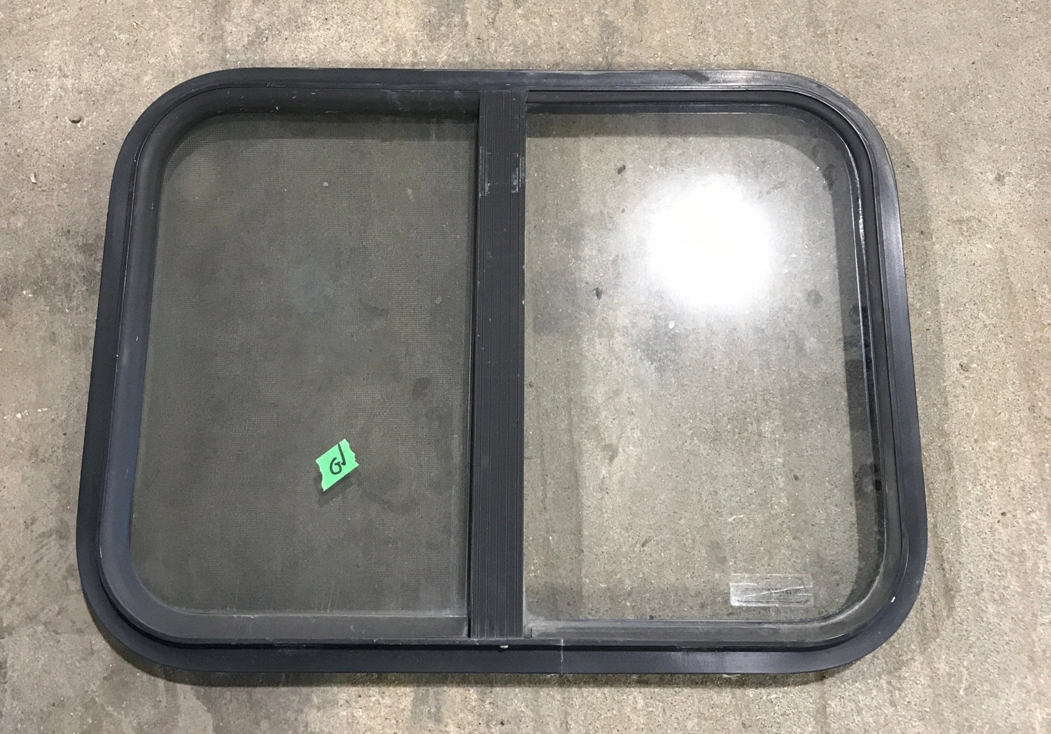 Used Black Radius Opening Window : 24 1/4" W x 17 3/4" H x 1 1/4" - Young Farts RV Parts
