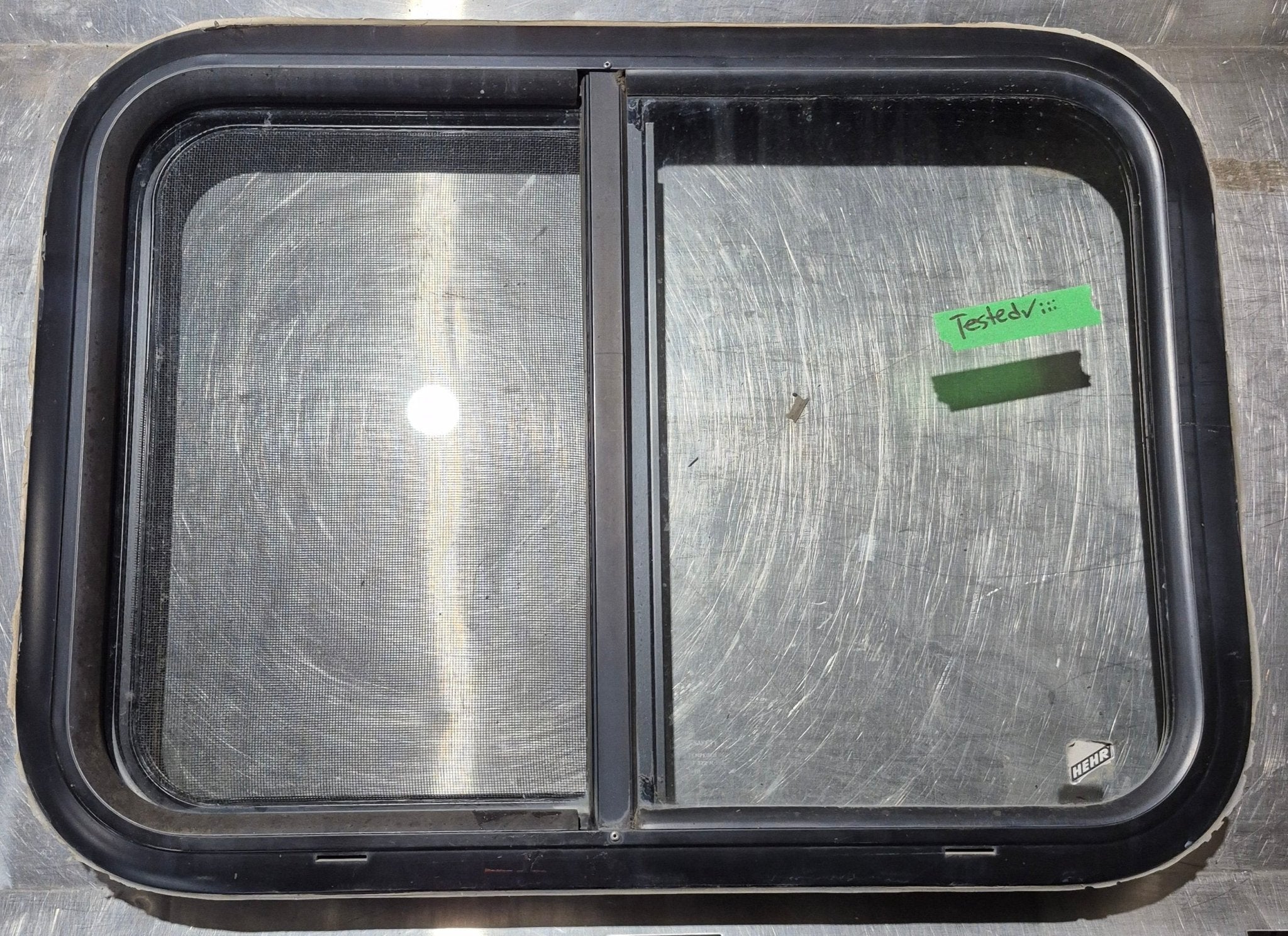 Used Black Radius Opening Window : 24 1/4" W x 17 3/4" H x 1 3/4" - Young Farts RV Parts
