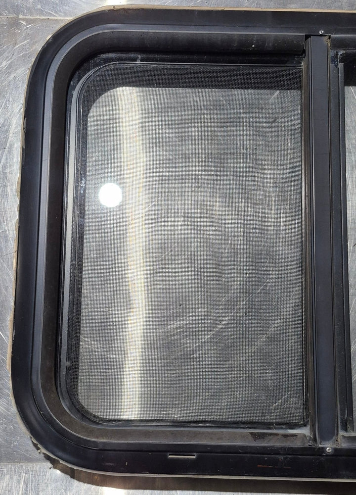Used Black Radius Opening Window : 24 1/4" W x 17 3/4" H x 1 3/4" - Young Farts RV Parts