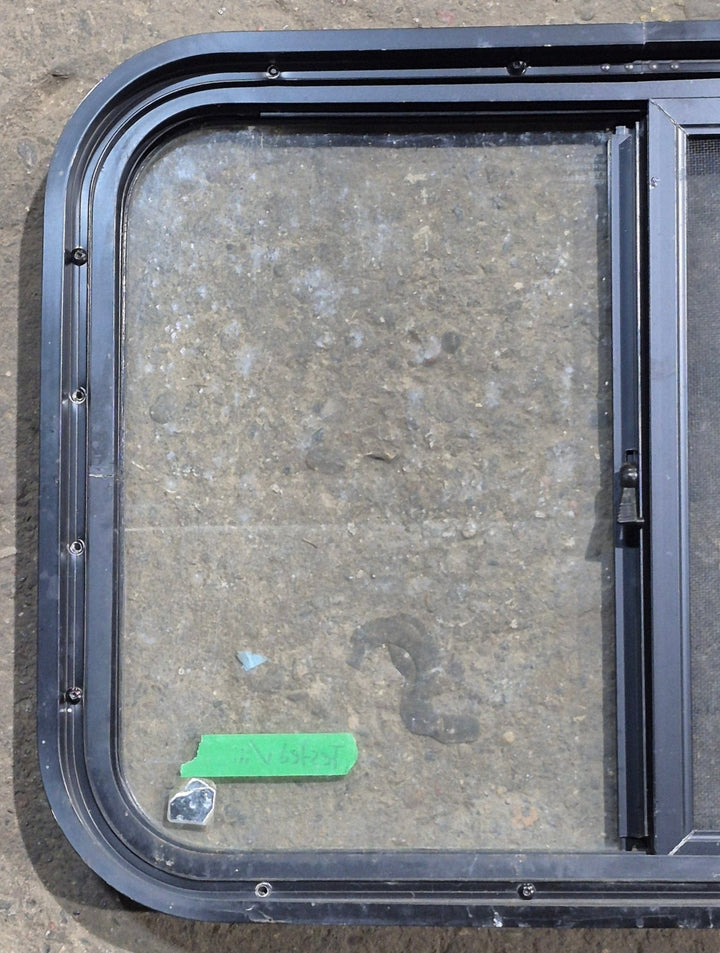 Used Black Radius Opening Window : 24 1/4" W x 17 3/4" H x 1 5/8" D - Young Farts RV Parts