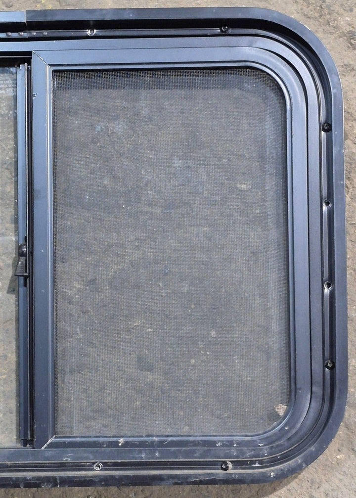 Used Black Radius Opening Window : 24 1/4" W x 17 3/4" H x 1 5/8" D - Young Farts RV Parts