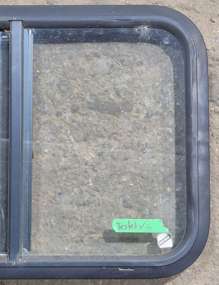 Used Black Radius Opening Window : 24 1/4" W x 17 3/4" H x 1 5/8" D - Young Farts RV Parts