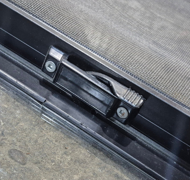 Used Black Radius Opening Window : 24 1/4" W x 21 3/4" H x 1 7/8" - Young Farts RV Parts