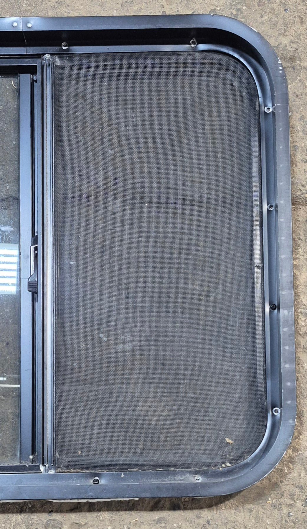 Used Black Radius Opening Window : 24 1/4" W x 21 3/4" H x 1 7/8" - Young Farts RV Parts