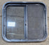 Used Black Radius Opening Window : 24 1/4" W x 21 3/4" H x 1 7/8" - Young Farts RV Parts