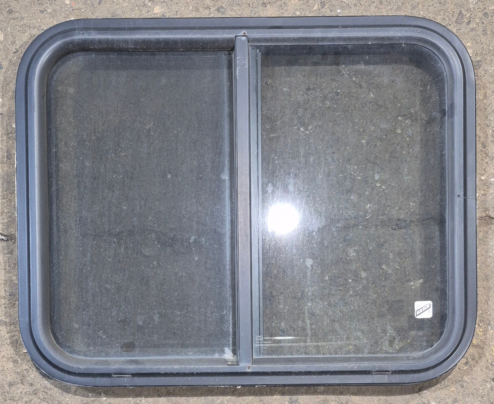 Used Black Radius Opening Window : 25 1/2" W x 20" H x 1 3/4" - Young Farts RV Parts