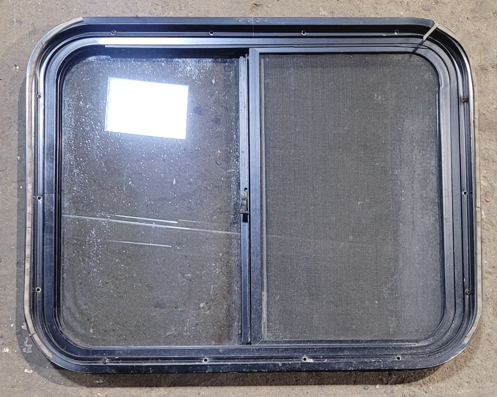 Used Black Radius Opening Window : 25 1/2" W x 20" H x 1 3/4" - Young Farts RV Parts