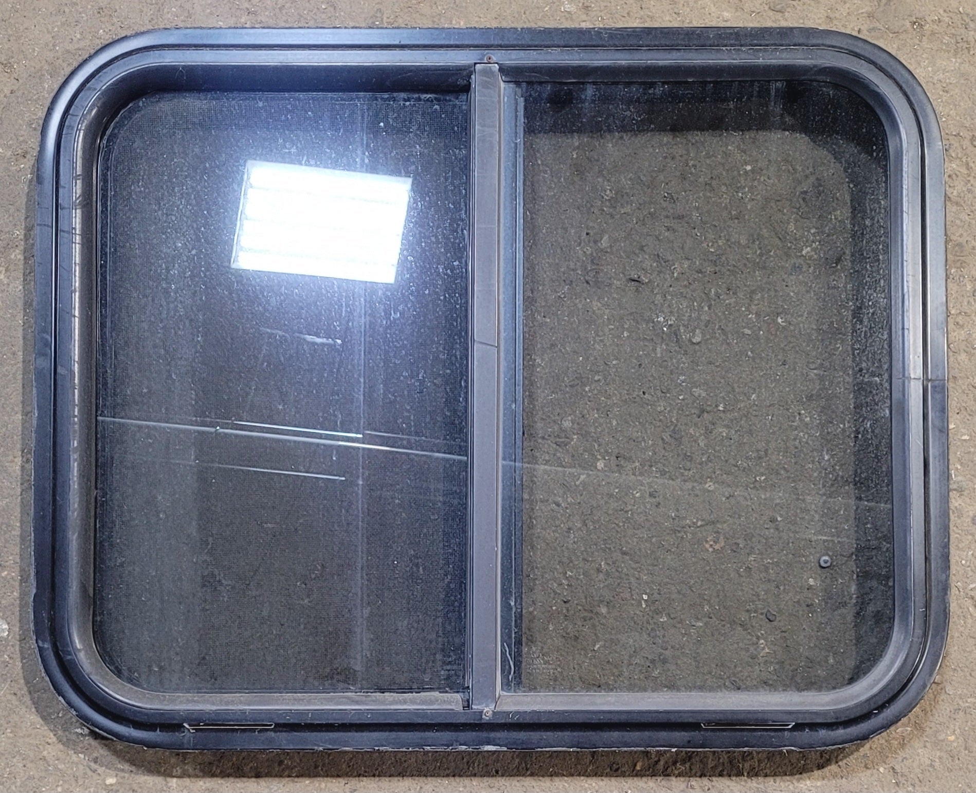 Used Black Radius Opening Window : 25 1/2" W x 20" H x 1 3/4" - Young Farts RV Parts