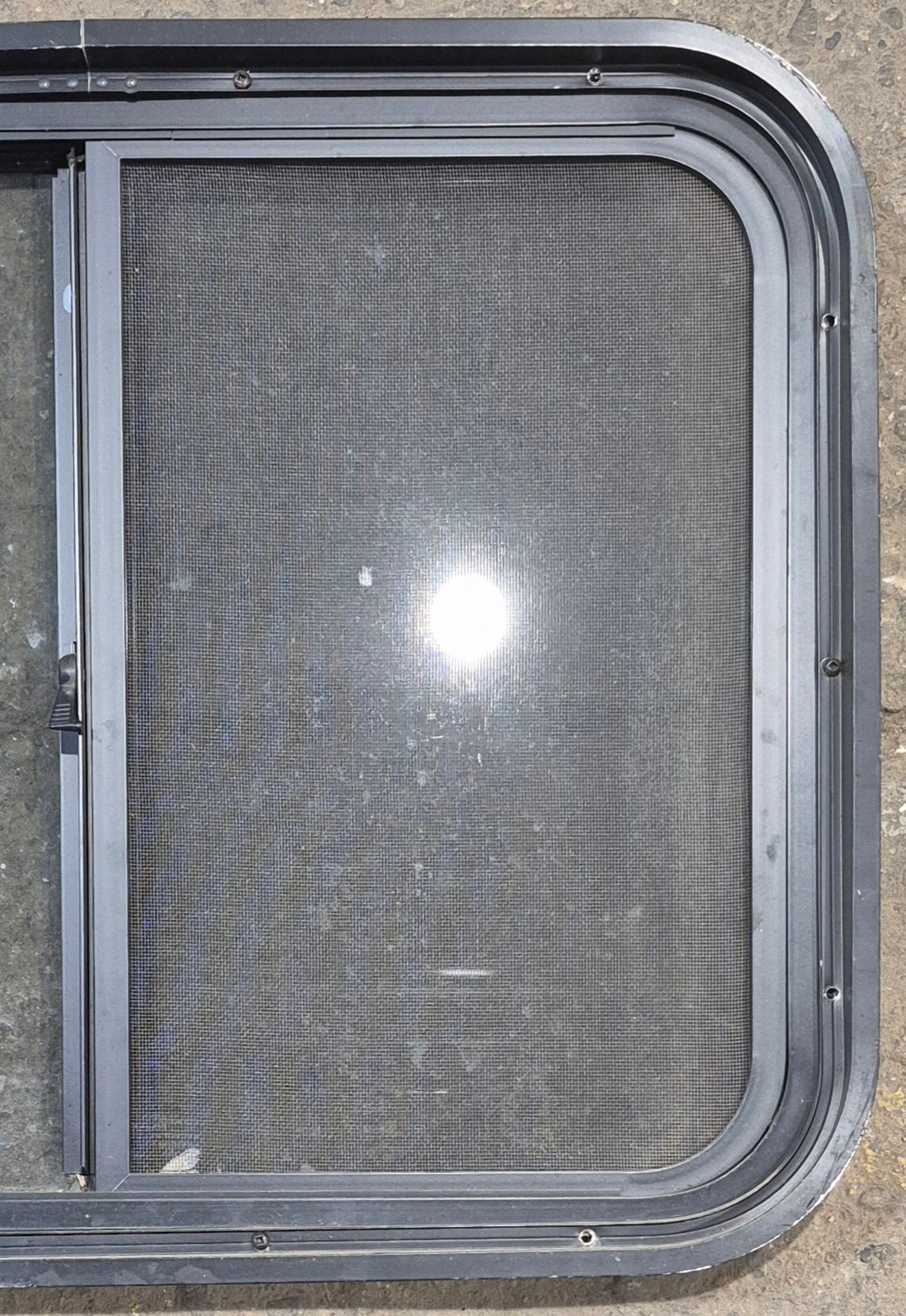 Used Black Radius Opening Window : 25 1/2" W x 20" H x 1 3/4" - Young Farts RV Parts