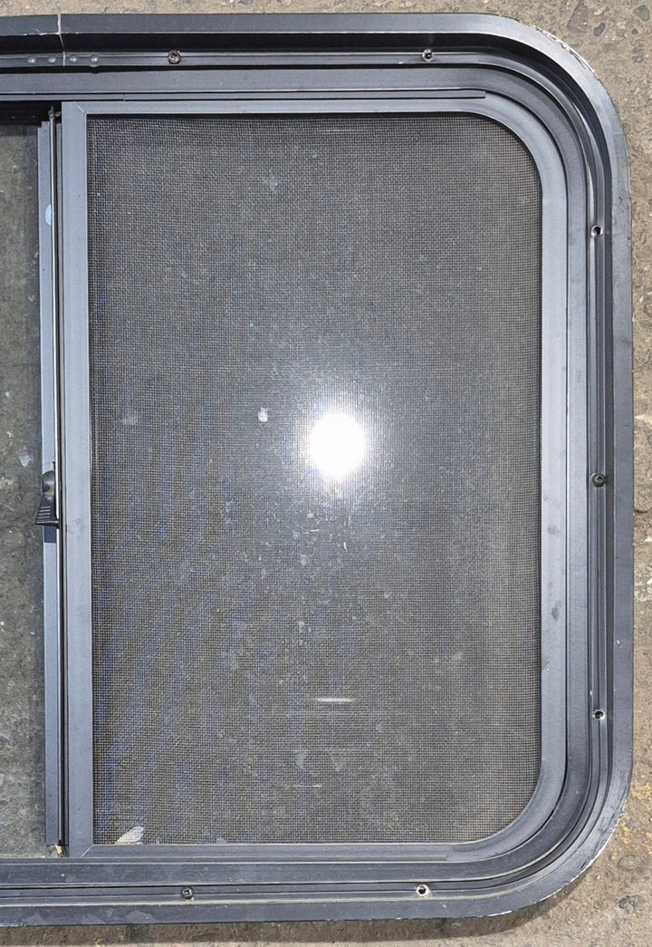 Used Black Radius Opening Window : 25 1/2" W x 20" H x 1 3/4" - Young Farts RV Parts