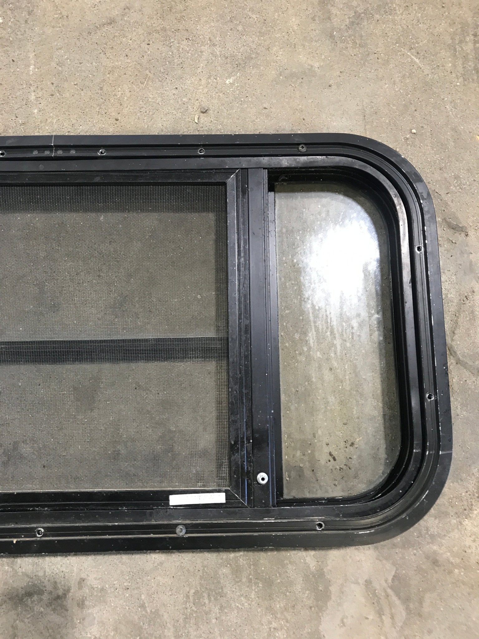 Used Black Radius Opening Window : 29 1/2" W x 14 1/2" H x 2" - Young Farts RV Parts