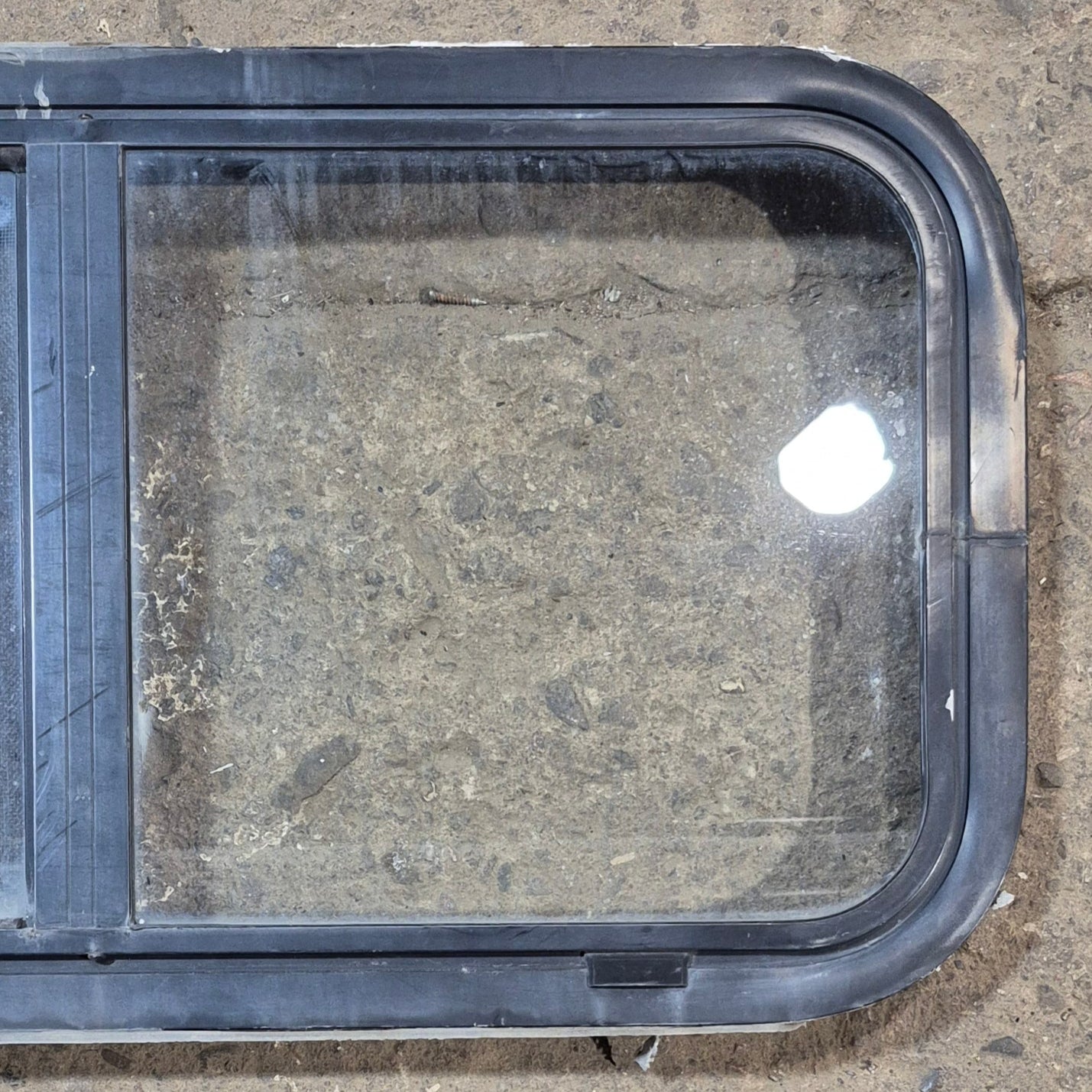 Used Black Radius Opening Window : 29 1/2" W x 14 3/4" H x 1 7/8" - Young Farts RV Parts